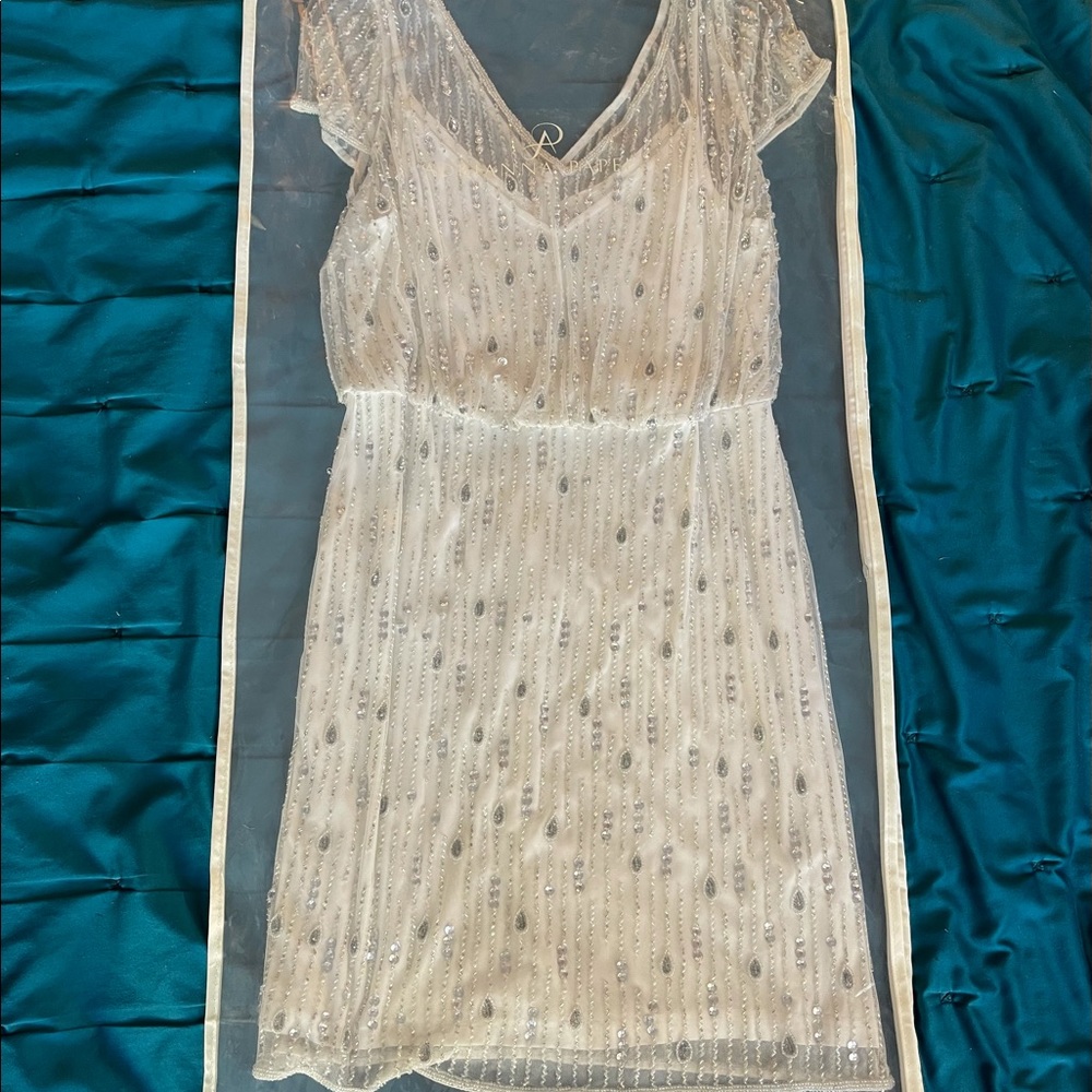 White beaded mid length dress